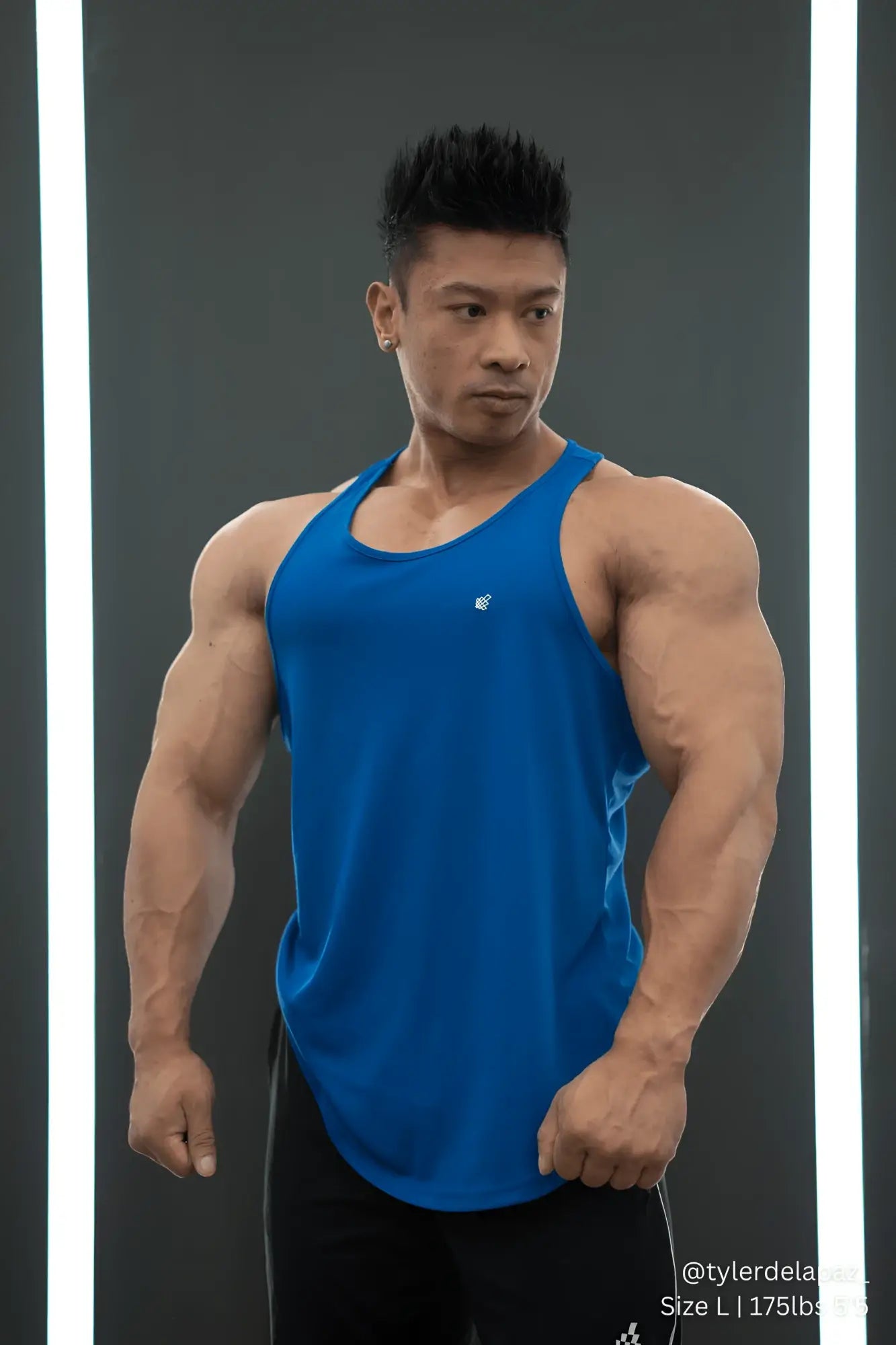 Blue fast-dry bodybuilding workout stringer tank top designed for athletic performance and quick moisture wicking