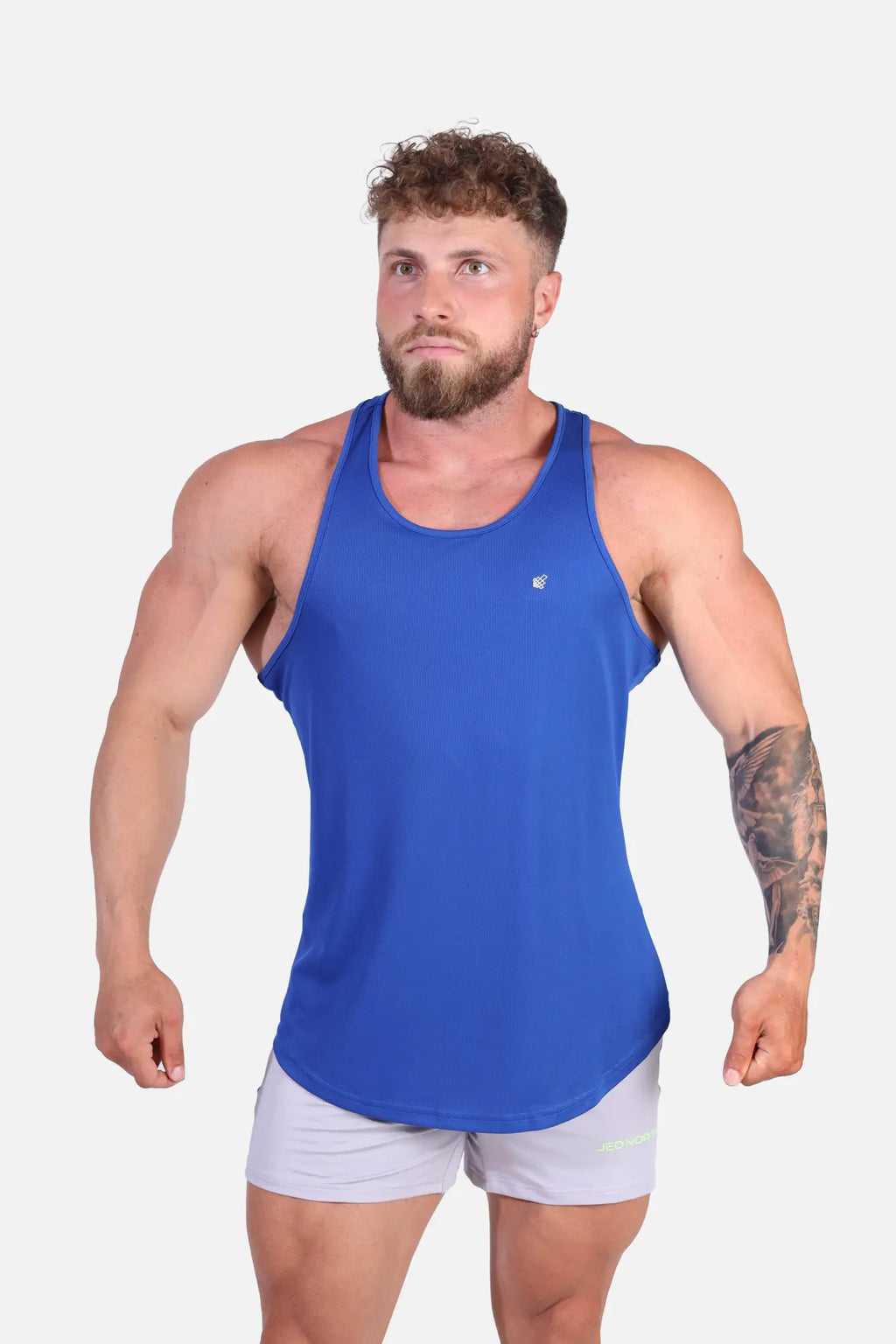 Blue athletic tank top with subtle chest logo fast-dry fabric designed for bodybuilding workouts