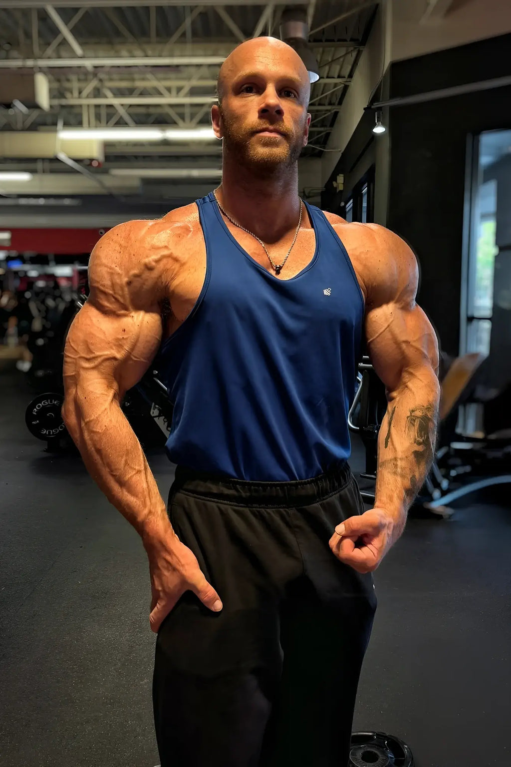 Blue athletic tank top fast-dry bodybuilding workout stringer with small chest logo in royal blue color