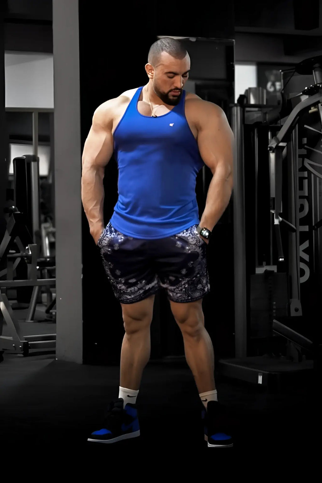 Blue fast-dry bodybuilding workout stringer tank top with small white logo on chest in royal blue color