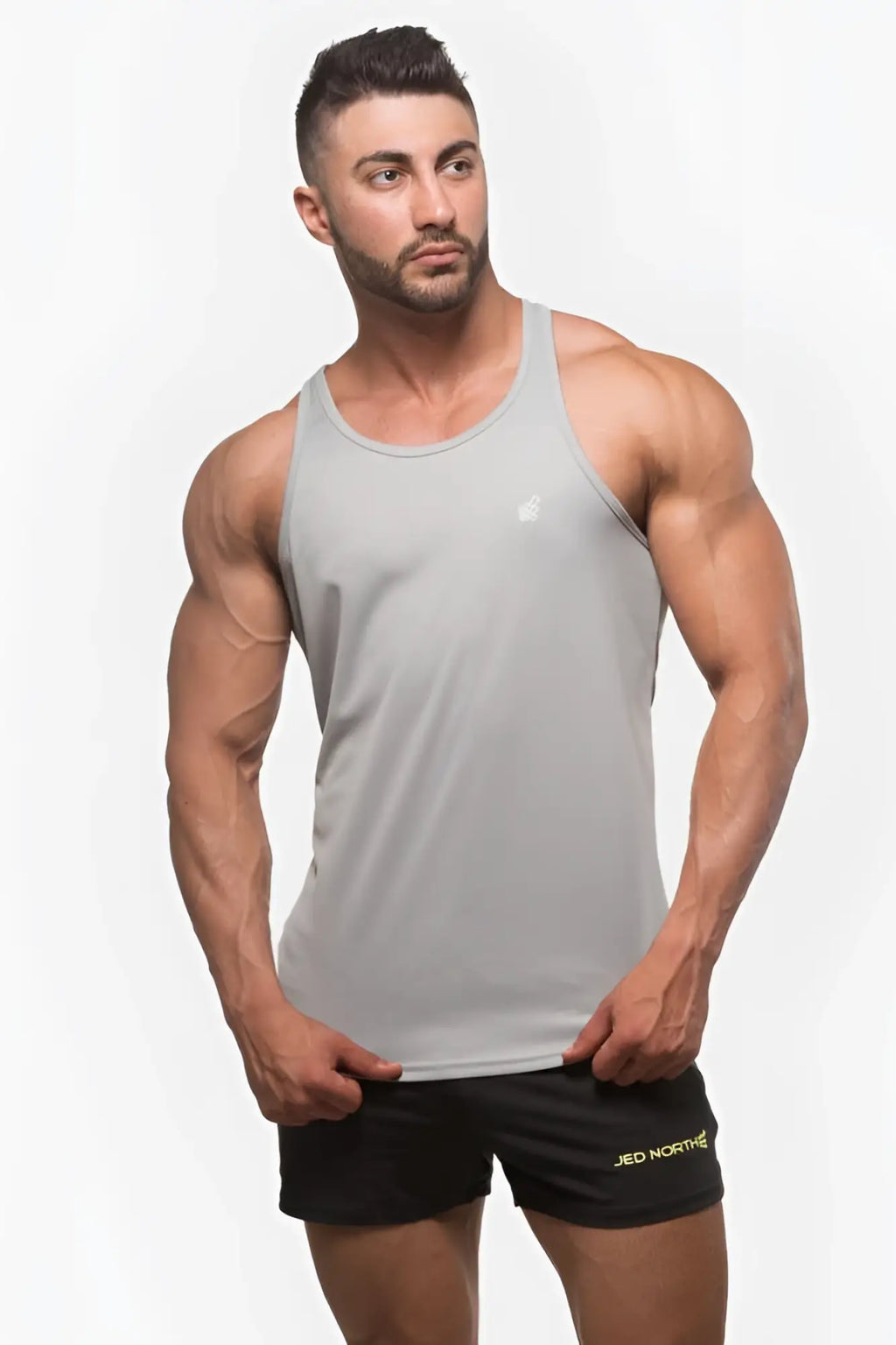 Gray jed north fast-dry bodybuilding workout stringer tank top with small white logo on upper left chest in silver