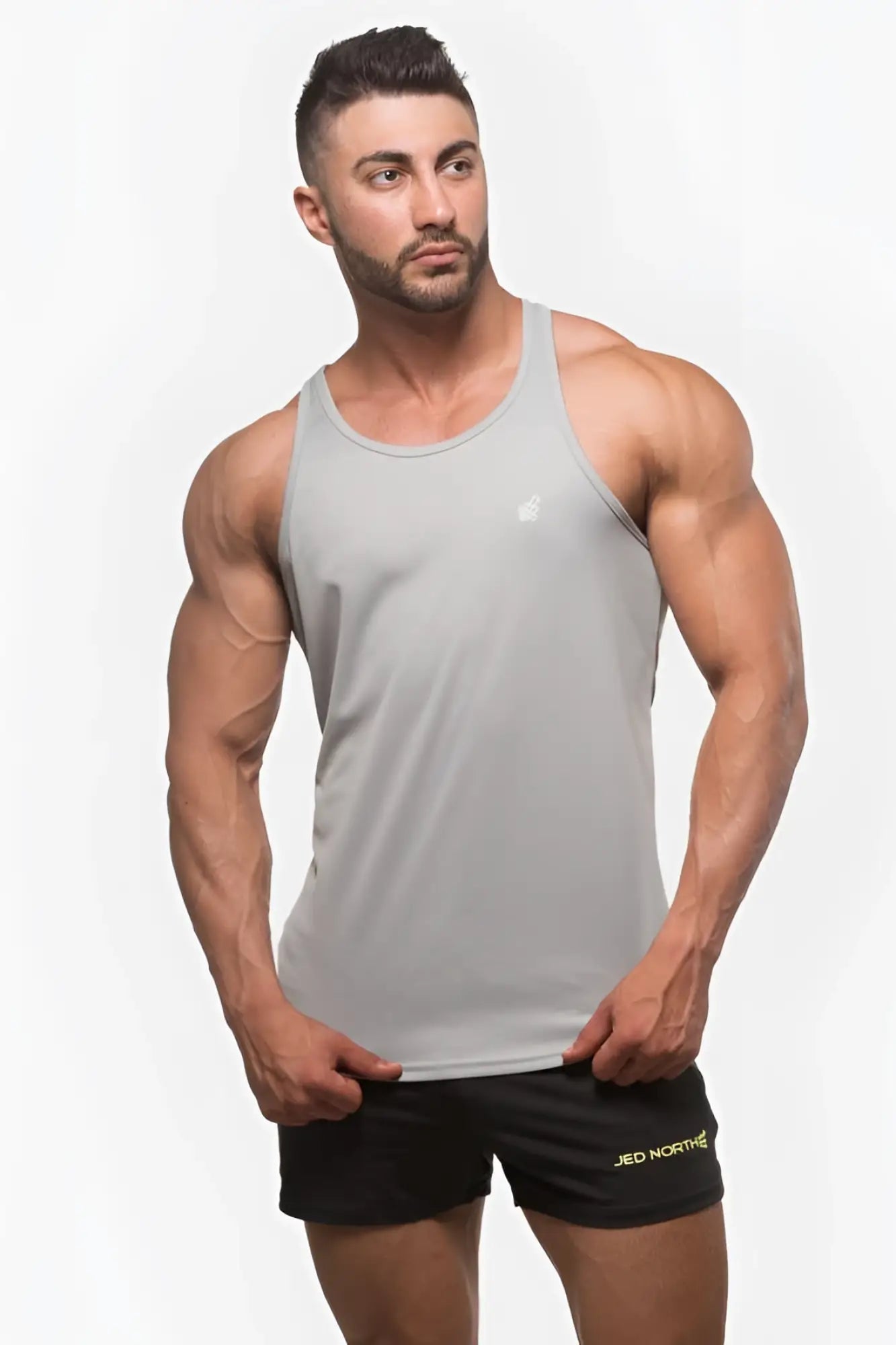 Gray jed north fast-dry bodybuilding workout stringer tank top with small white logo on upper left chest in silver
