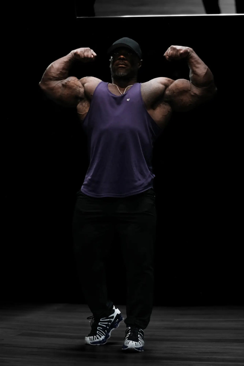 Purple sleeveless jed north fast dry bodybuilding workout stringer tank top designed for athletic performance