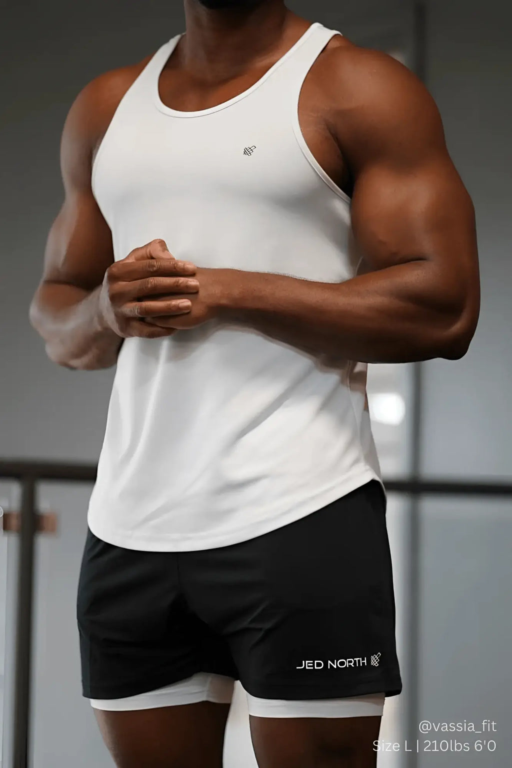 White sleeveless jed north fast dry bodybuilding workout stringer tank top with subtle chest logo