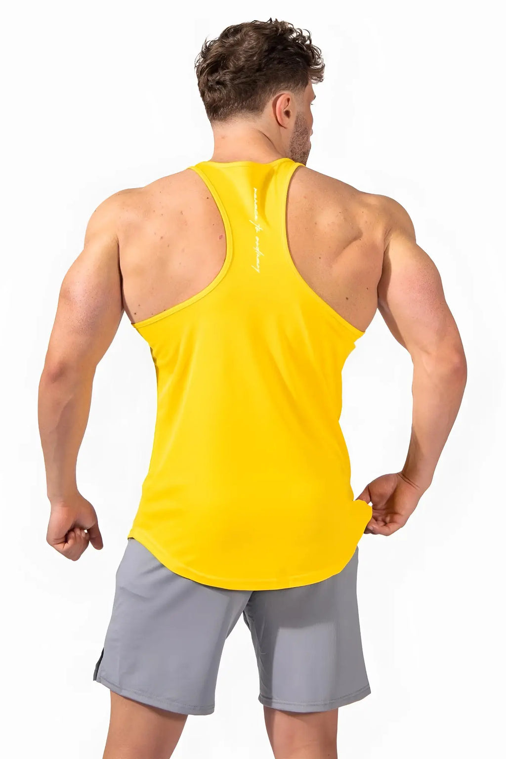 Bright yellow jed north fast-dry bodybuilding workout stringer tank top with racerback and vertical branding on the back