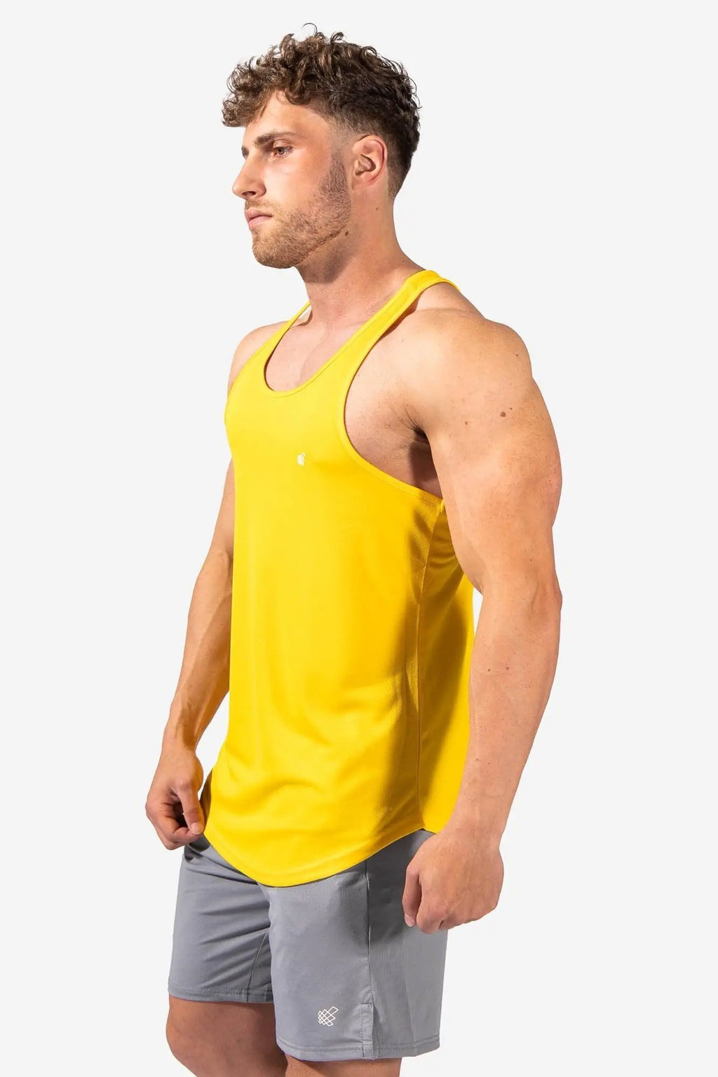 Jed North fast-dry bodybuilding workout stringer in bright yellow sleeveless tank top with scoop neckline and curved hem