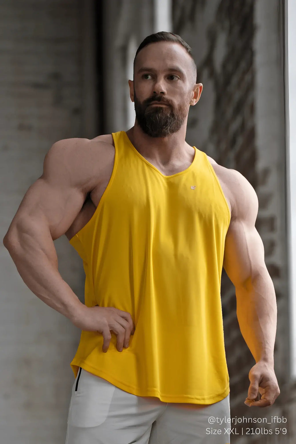 Bright yellow Jed North Fast-Dry sleeveless bodybuilding workout tank top with v-neck and subtle logo on left chest
