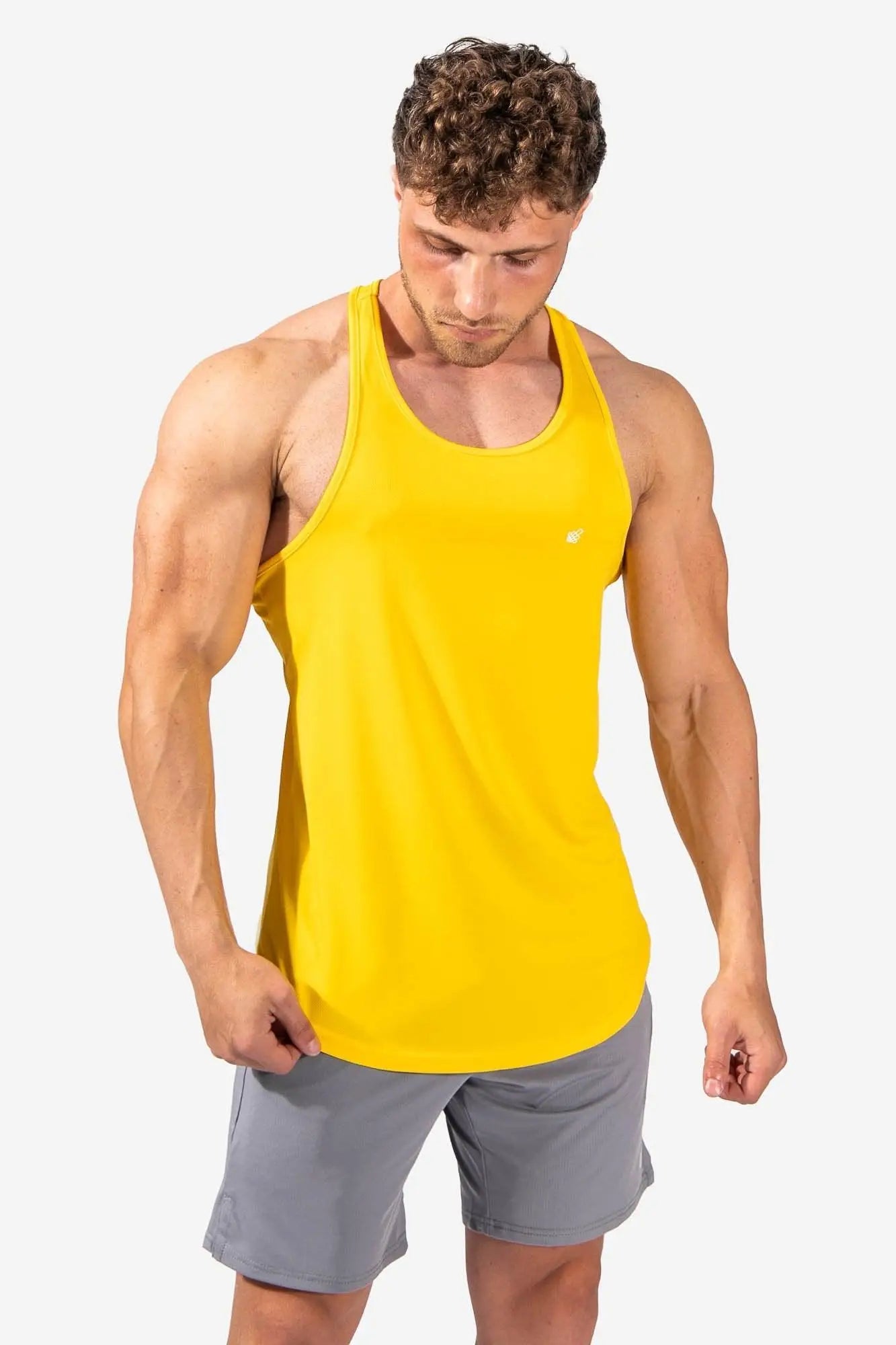 Jed North fast-dry bodybuilding workout stringer is a bright yellow sleeveless fitted tank top for exercise