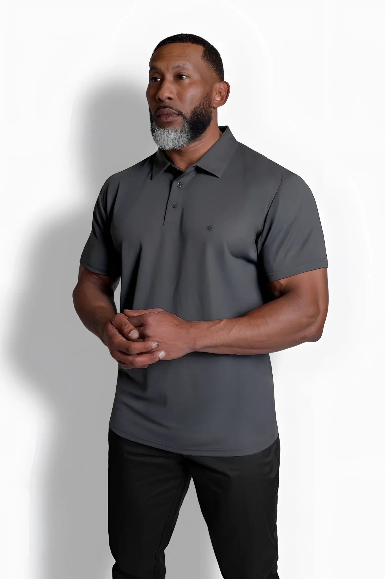 Dark gray fast-dry polo t-shirt with short sleeves, subtle textured fabric, and small logo on left chest