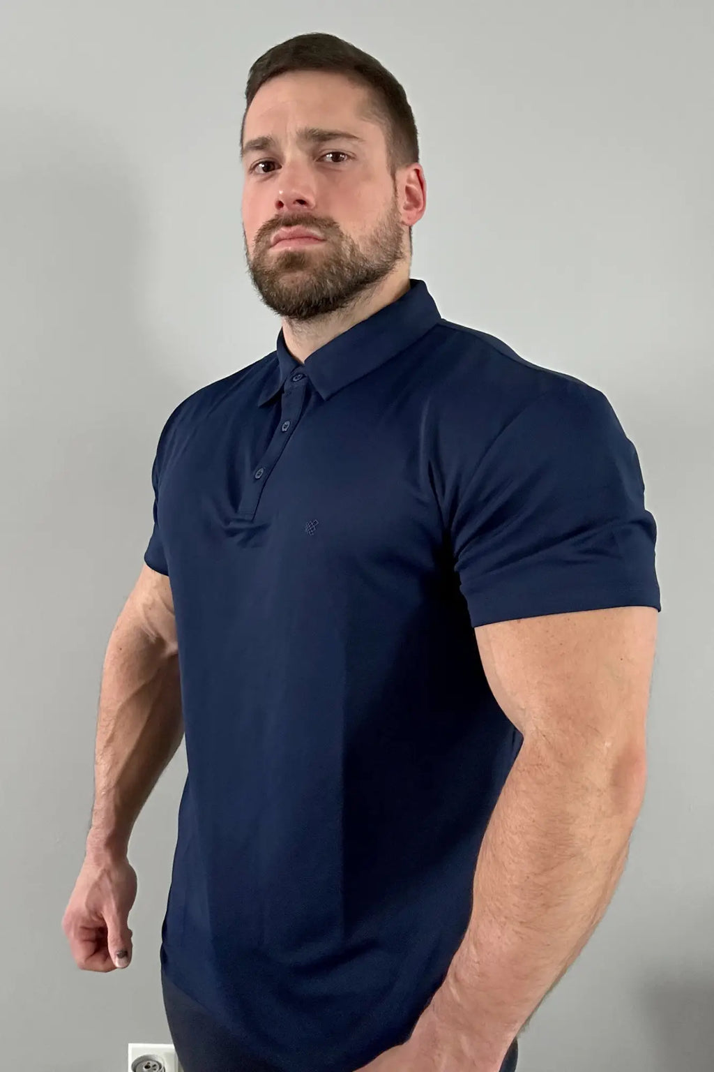 Navy blue fast-dry polo t-shirt with short sleeves collar and button placket for quick moisture-wicking comfort