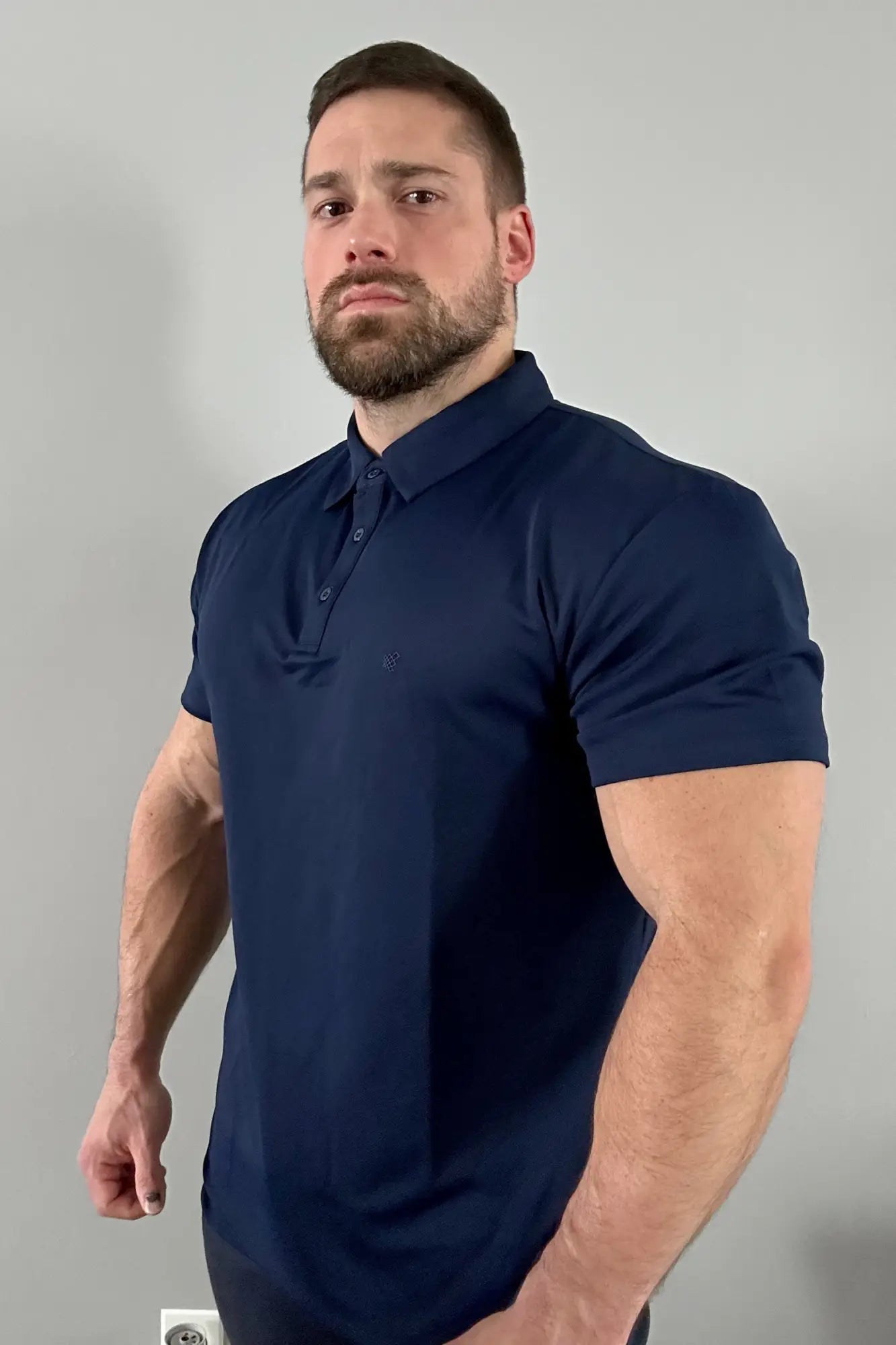 Navy blue fast-dry polo t-shirt with short sleeves collar and button placket for quick moisture-wicking comfort