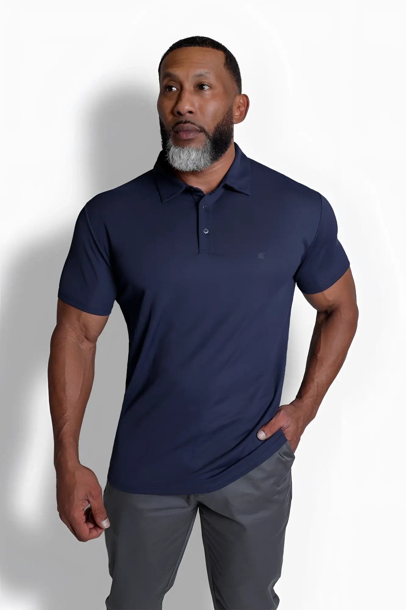 Navy blue fast-dry short-sleeved polo shirt with subtle chest logo made from breathable fabric for active wear