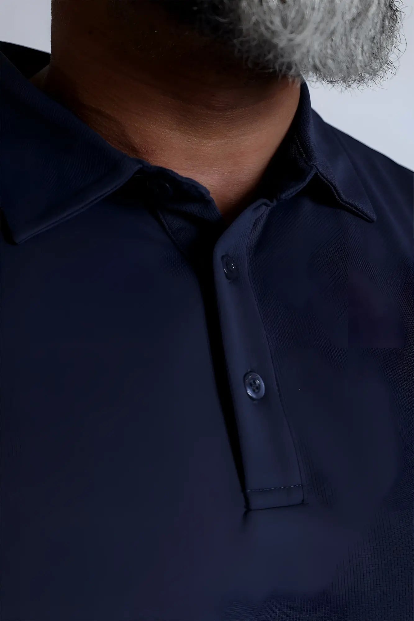 Navy fast-dry polo t-shirt with textured fabric, classic collar, and matching buttons for breathable comfort