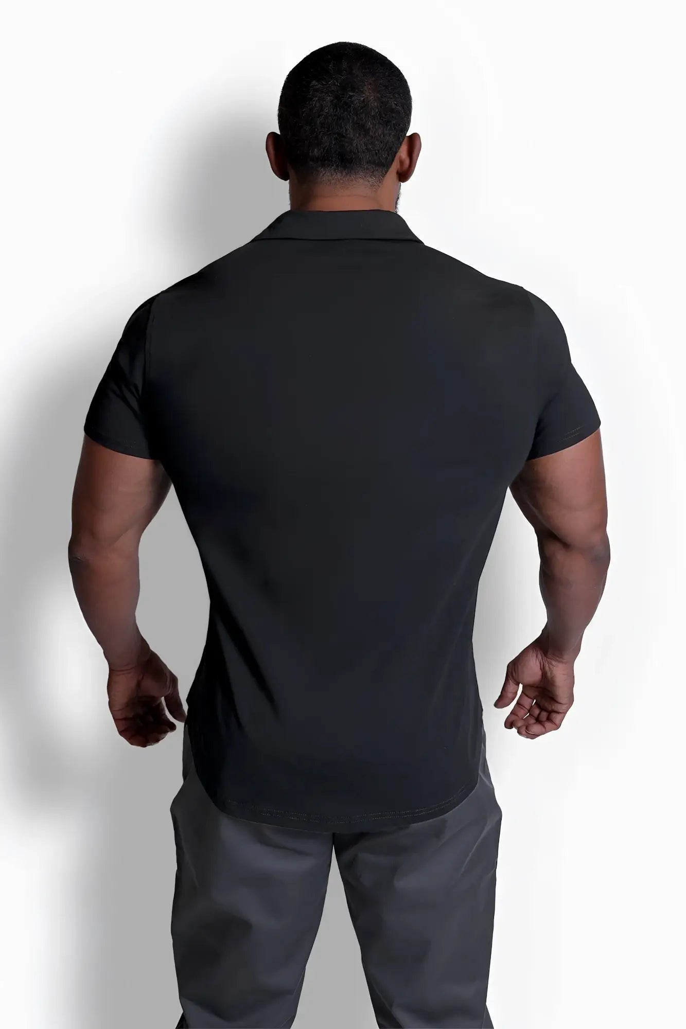 Black short-sleeved flex premium stretch button-up polo shirt with classic collar and tailored fit in onyx black