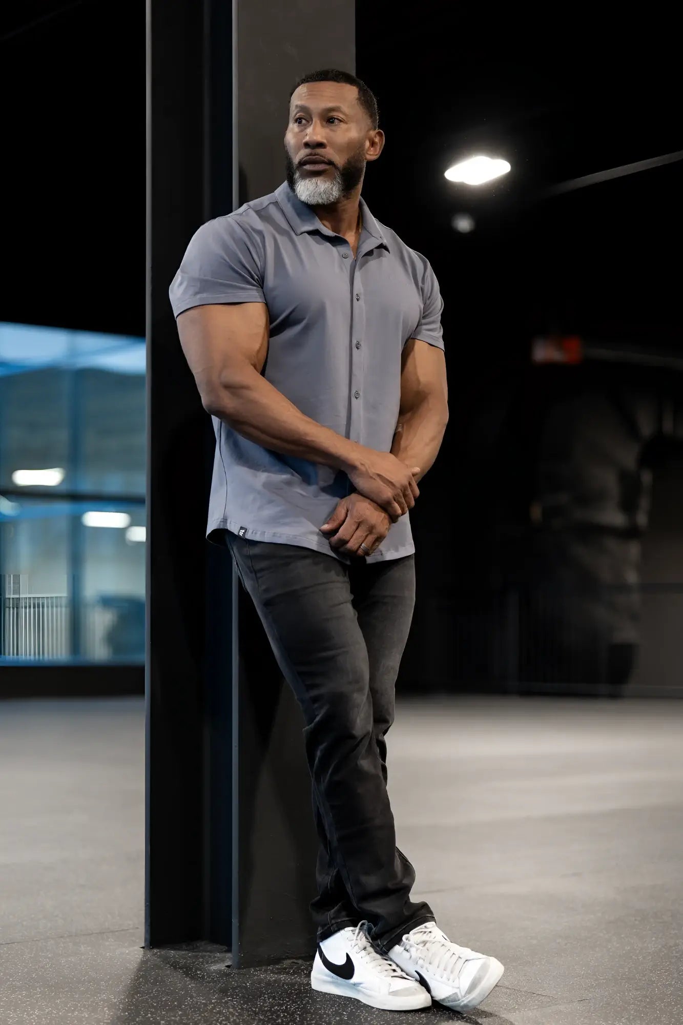 Gray short-sleeved flex premium stretch button-up shirt in storm gray showing front view with breathable fabric