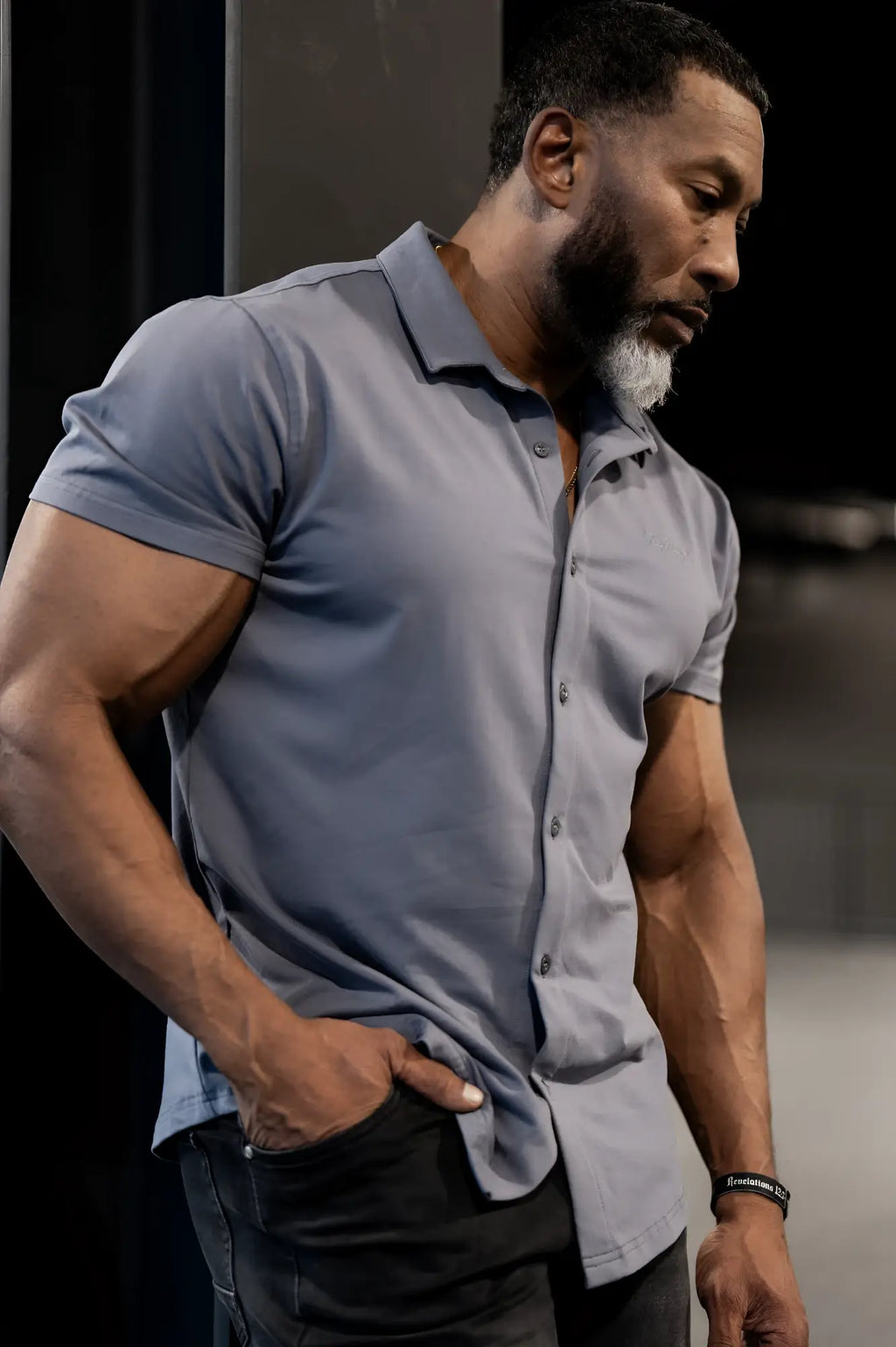 A sleek short-sleeved flex premium stretch button-up shirt in storm gray with a classic collar and subtle texture