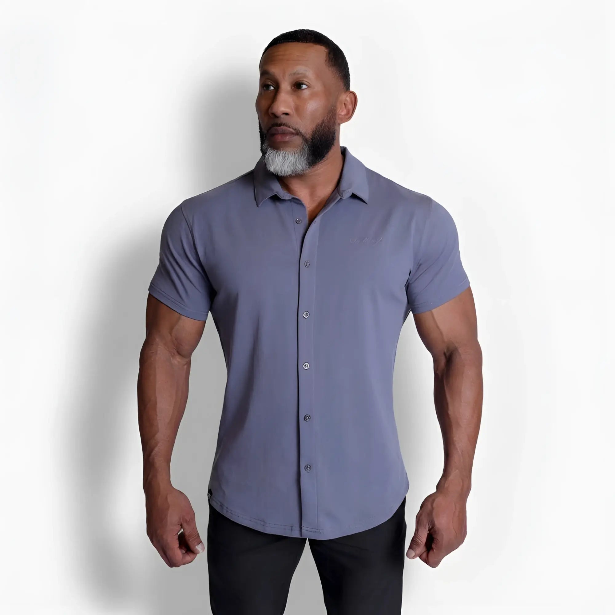 A sleek flex premium stretch button-up shirt in storm gray with short sleeves and subtle stitching details