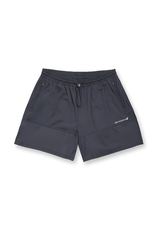 Fortis men’s athletic shorts in black feature a lightweight fabric drawstring waistband and subtle lower leg branding