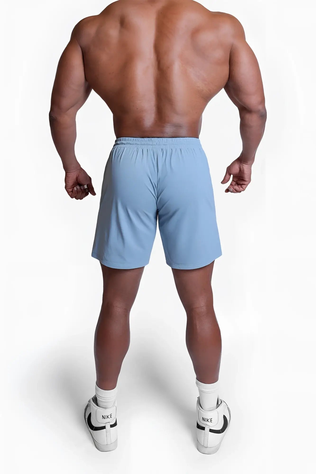 Light blue Fortis men’s athletic shorts with elastic waistband designed for comfortable sports wear