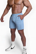 Fortis men’s athletic shorts in light blue with a drawstring waistband and side pockets for comfortable wear