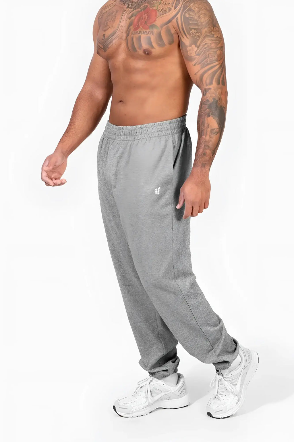Gray heathered french terry athletic training joggers by jed north with small white logo on left thigh