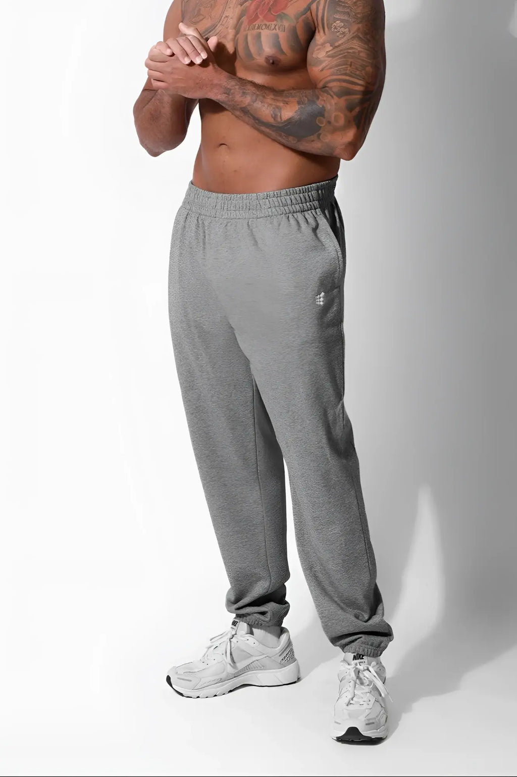 Gray heathered french terry athletic training joggers by jed north with small white logo on left thigh