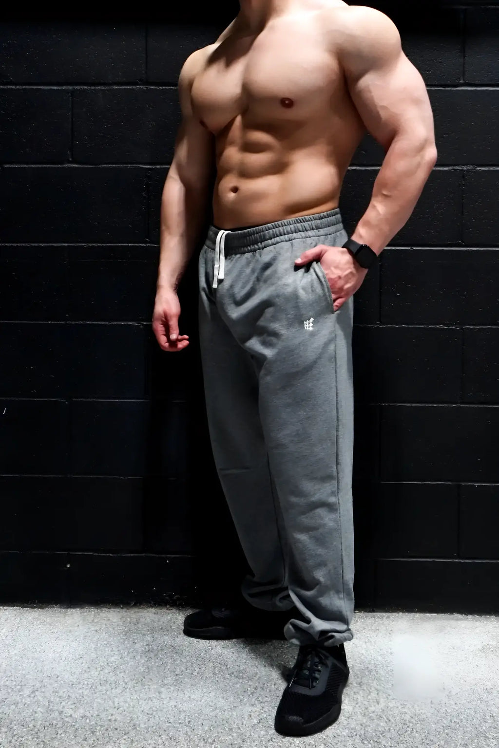 Gray jed north french terry athletic training joggers with white drawstrings and embroidered logo on left thigh
