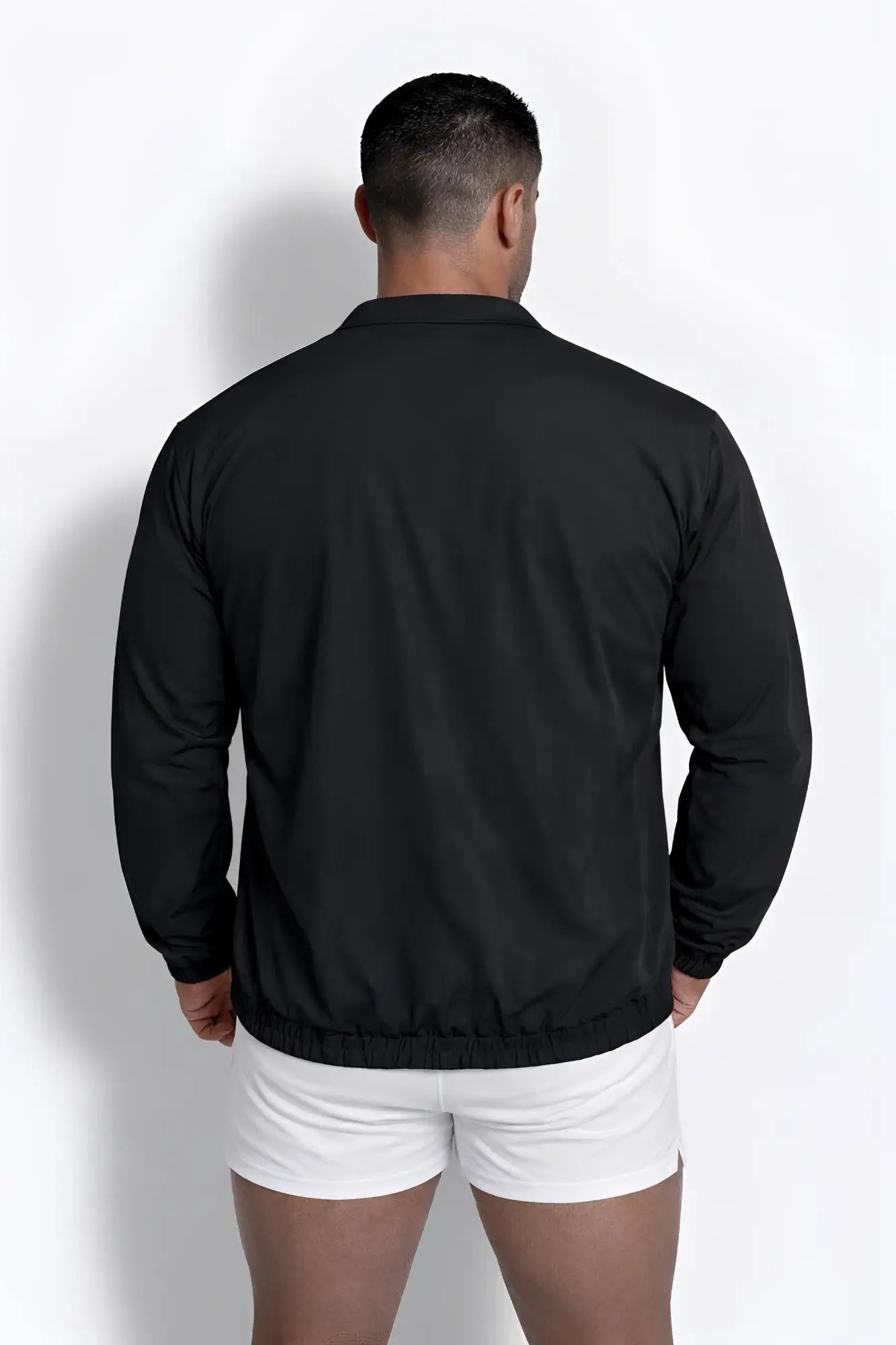 Black full-zip training jacket with long sleeves lightweight fabric ribbed hem and collar for active wear