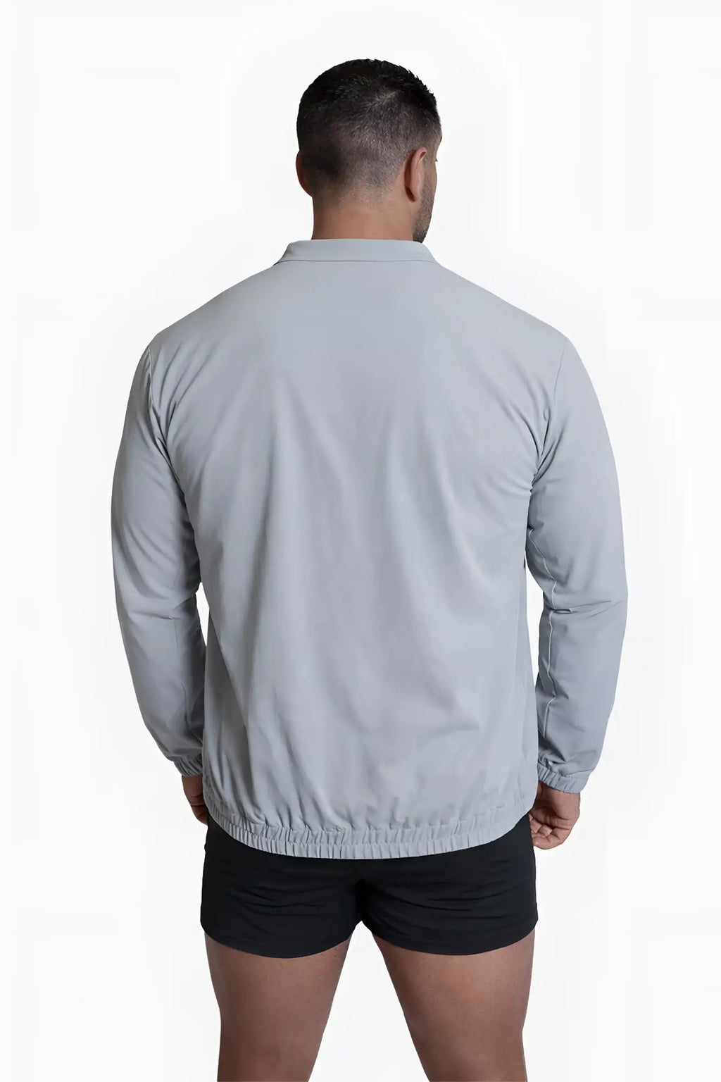 Light gray full-zip training jacket with collar long sleeves and elasticated hem for athletic use