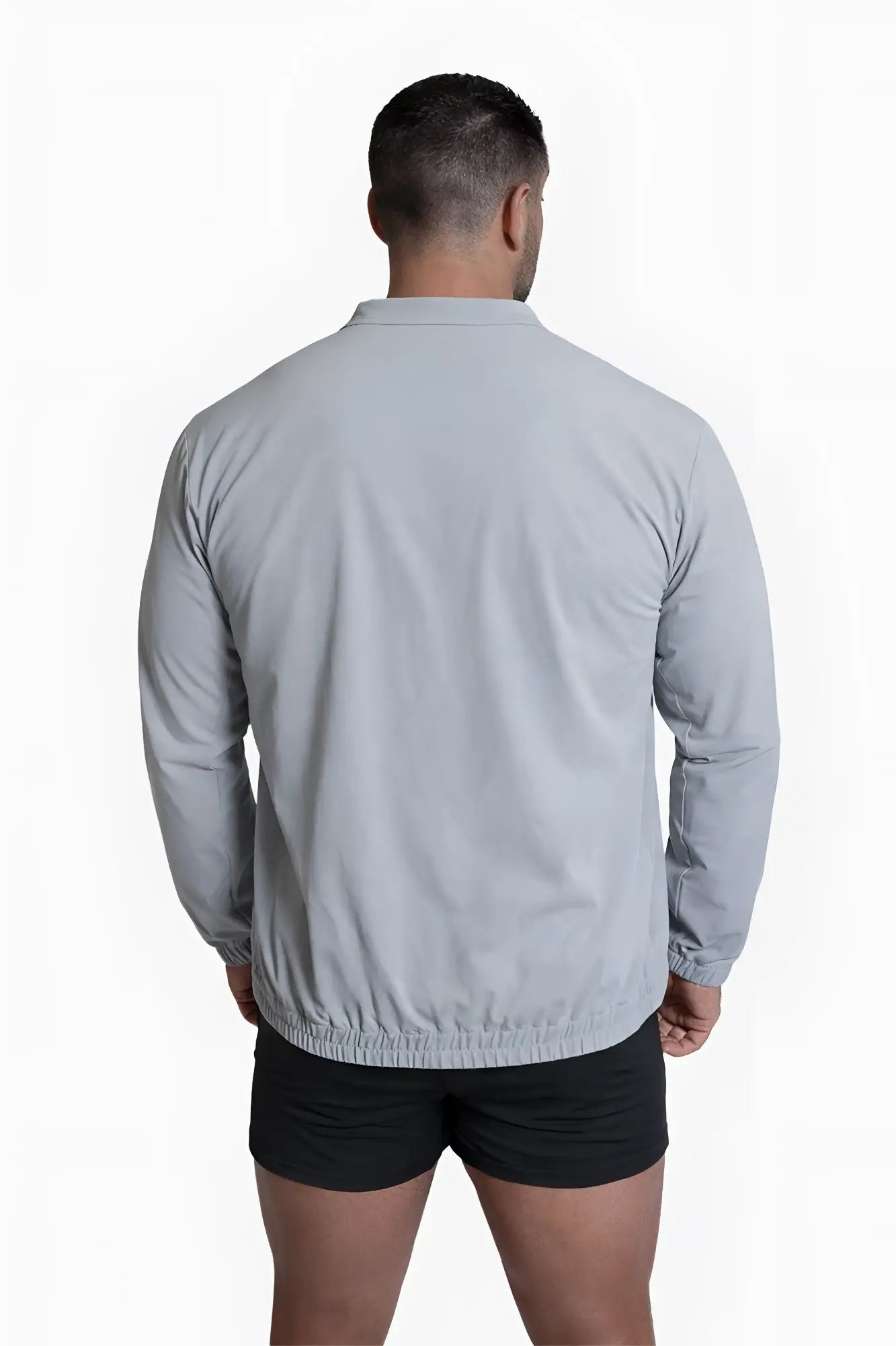 Light gray full-zip training jacket with collar long sleeves and elasticated hem for athletic use