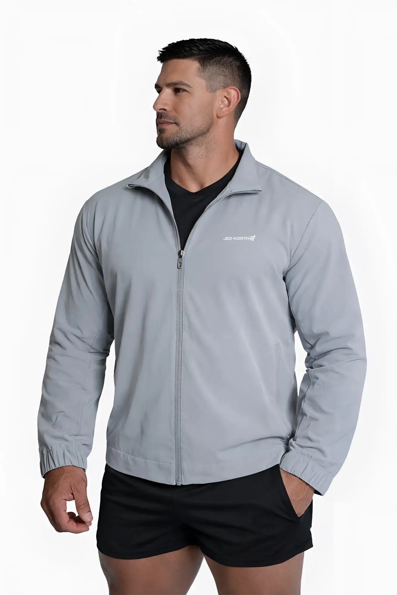 Light gray full-zip training jacket with subtle brand logo on left chest designed for athletic wear