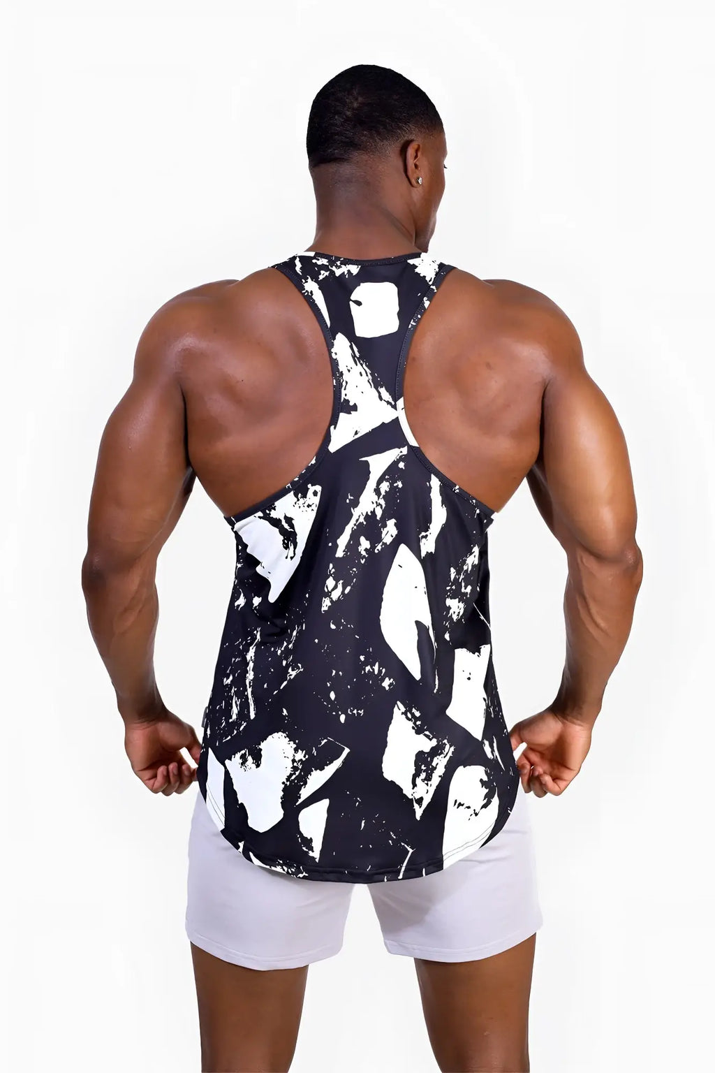 Black and white abstract paint-splatter pattern athletic tank top graphic muscle stringer for activewear use