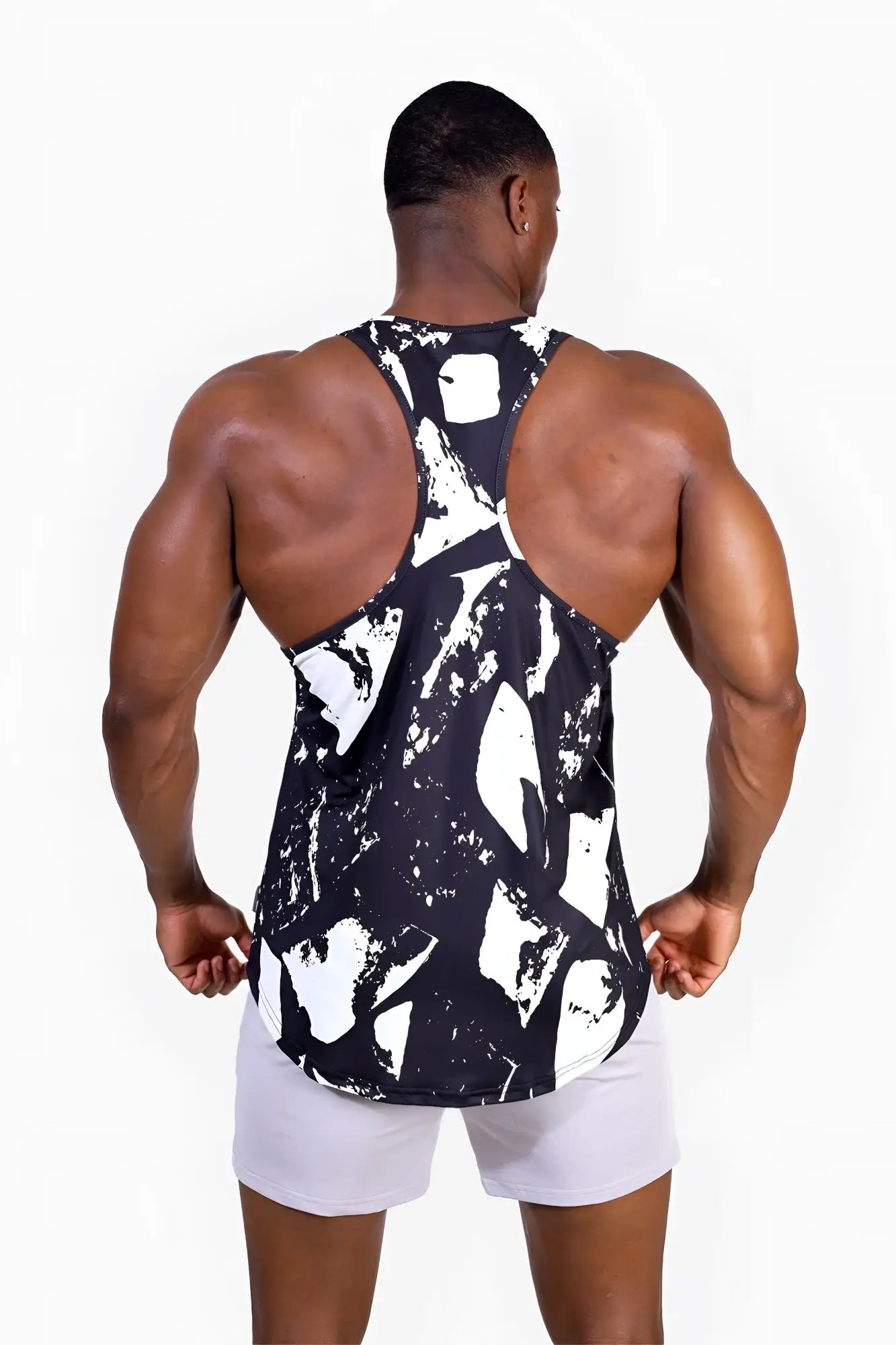 Black and white abstract paint-splatter pattern athletic tank top graphic muscle stringer for activewear use