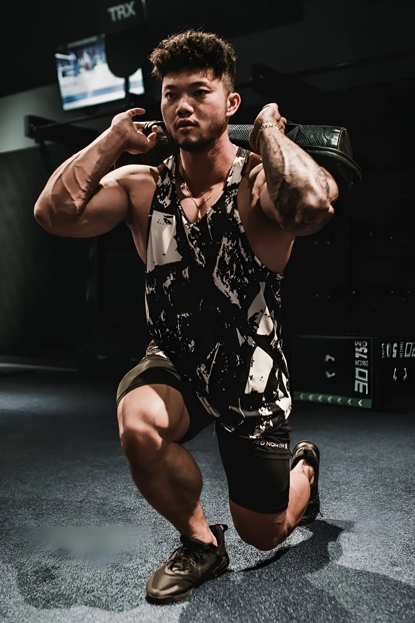 Black and white abstract patterned Graphic Muscle Stringer tank top with textured athletic design for workouts
