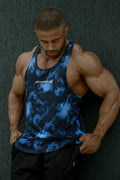 Blue and black tie-dye graphic muscle stringer tank top with jed north logo on the chest in abstract blue design