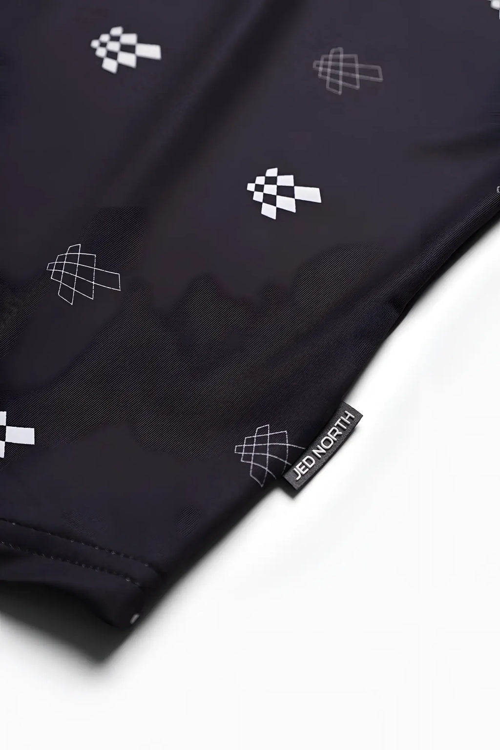 Black jed north graphic muscle stringer featuring white geometric checkered pattern and branded tag