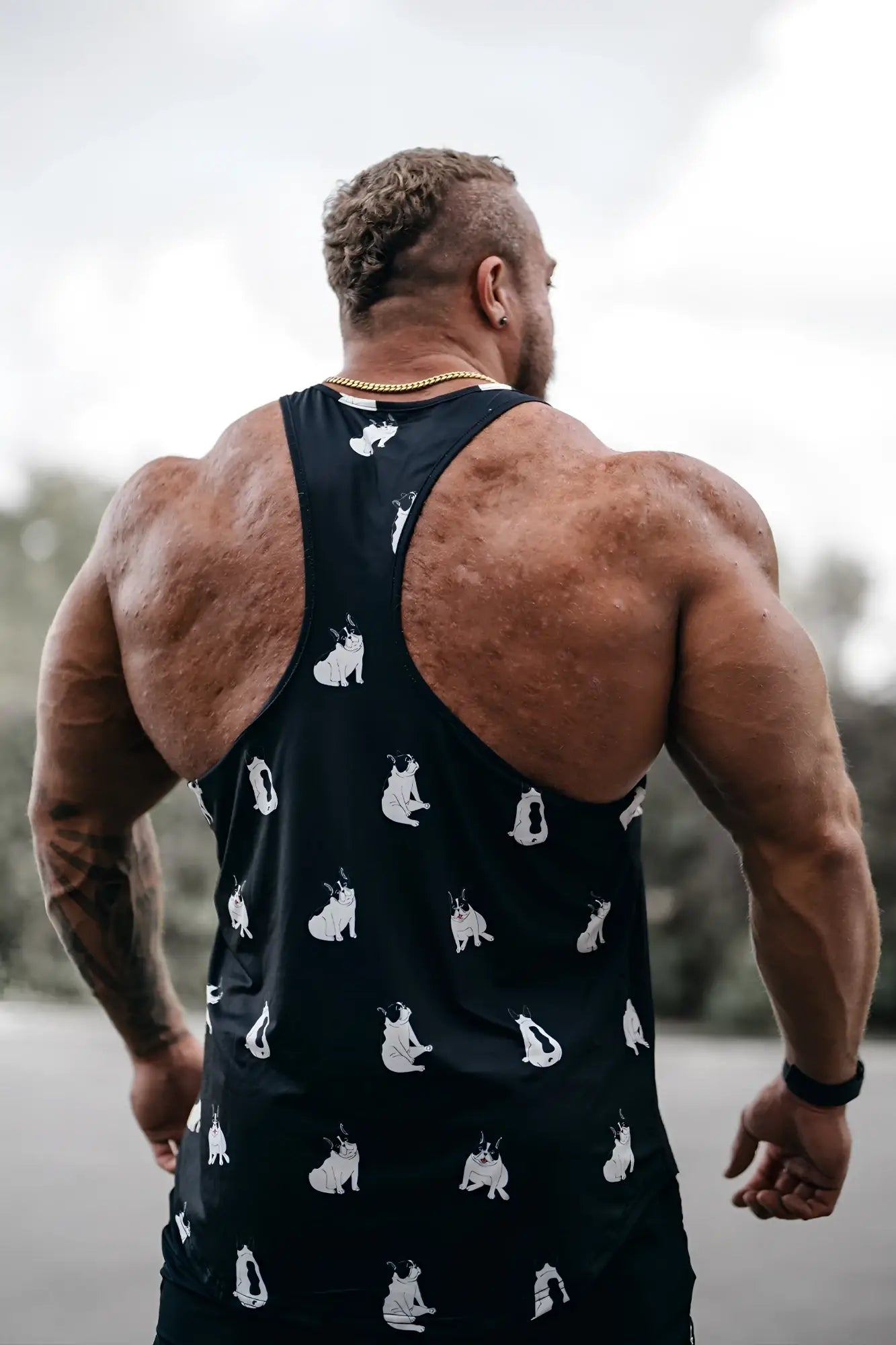 Black graphic muscle stringer tank top featuring white pug dog prints perfect for casual wear