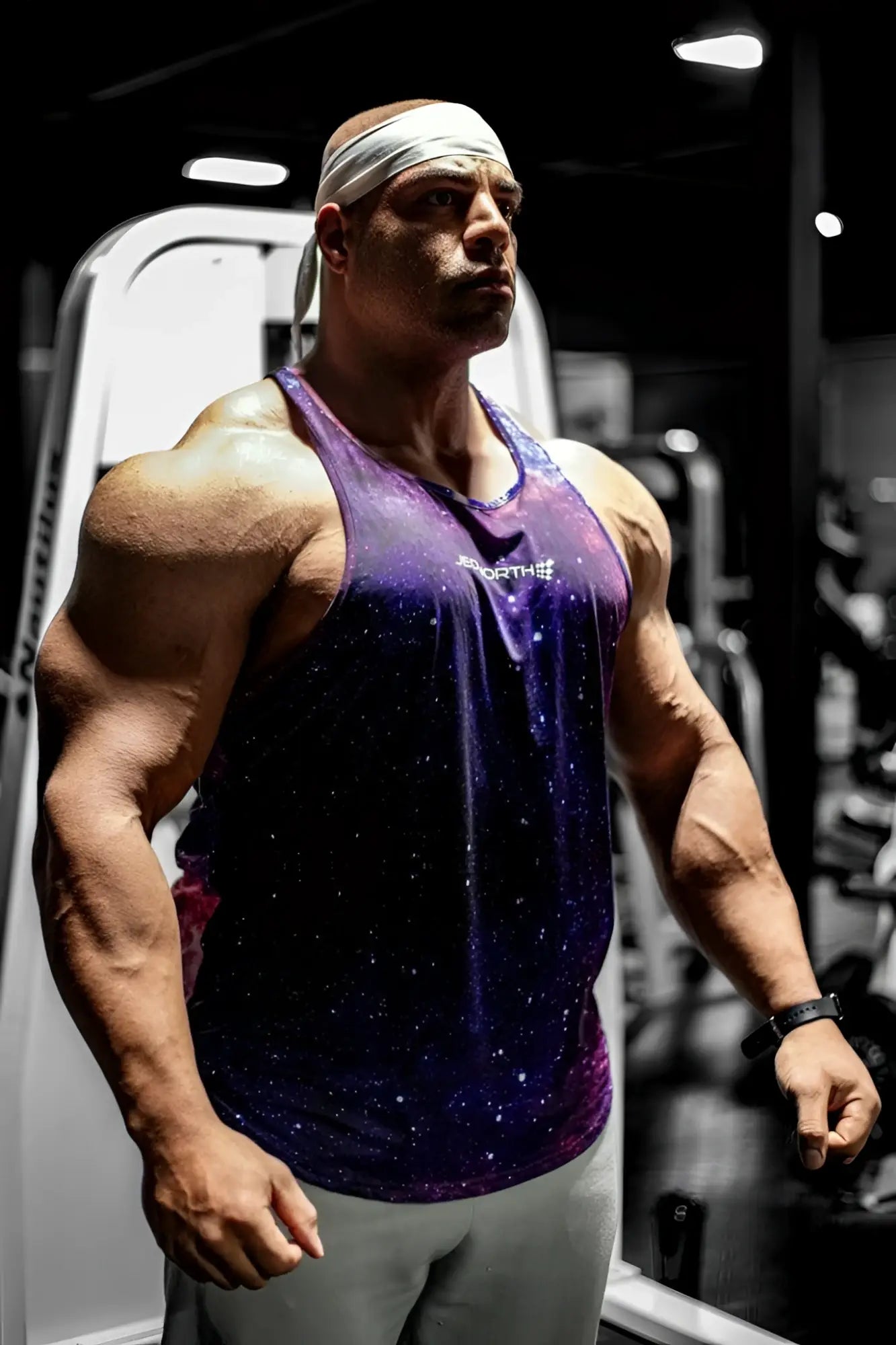 Purple galaxy-patterned tank top with subtle white logo on chest from jed north graphic muscle stringer galactic collection