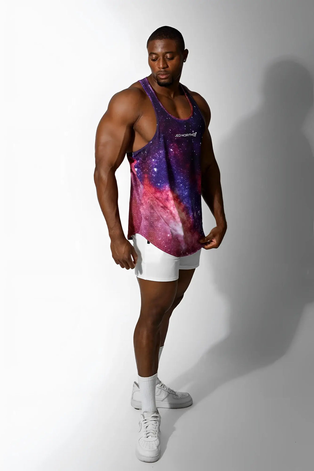 Jed North graphic muscle stringer tank top with vibrant purple pink and blue galaxy print and subtle shimmer
