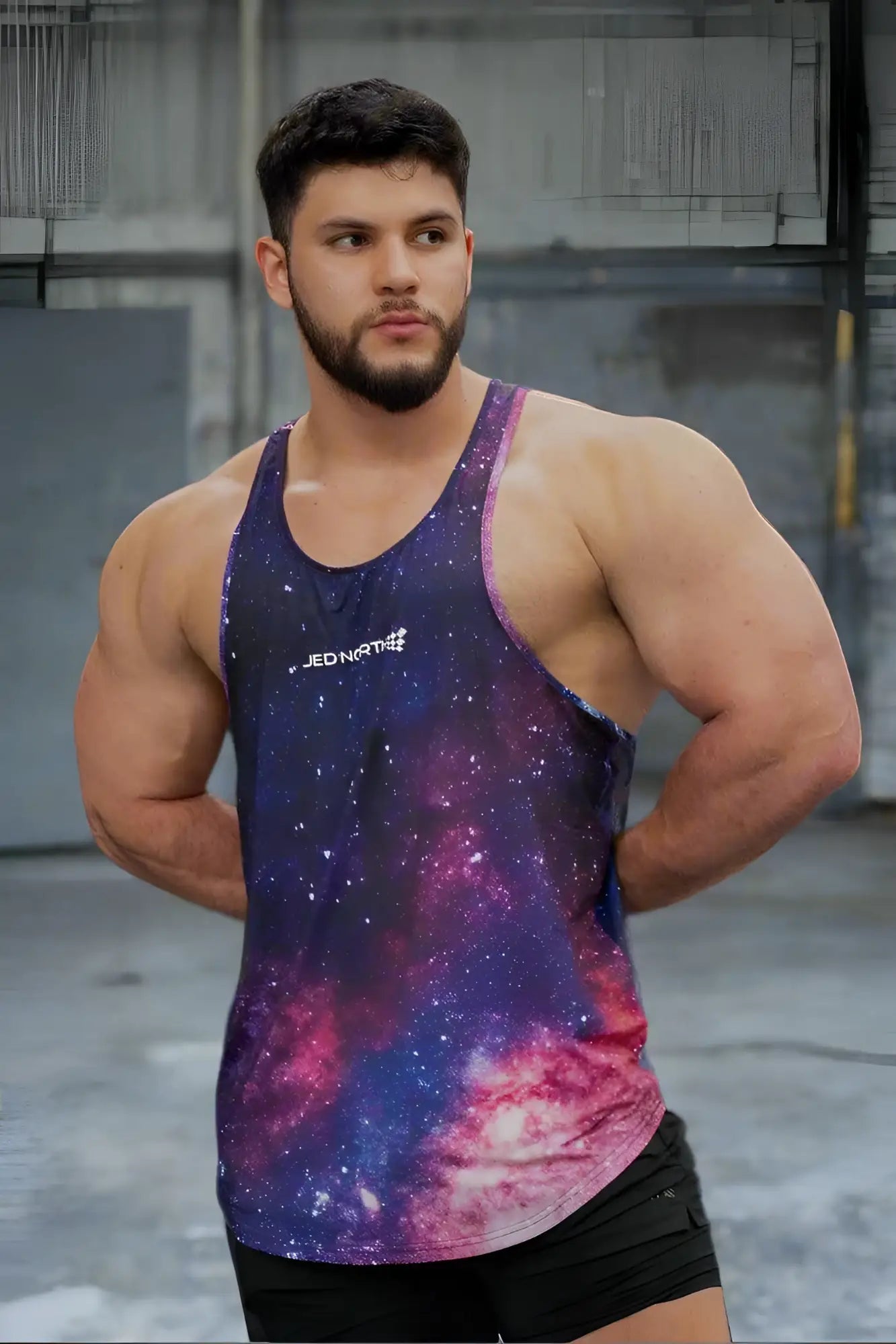 Jed North graphic muscle stringer tank top with vibrant galaxy-themed cosmic print in purple blue and pink