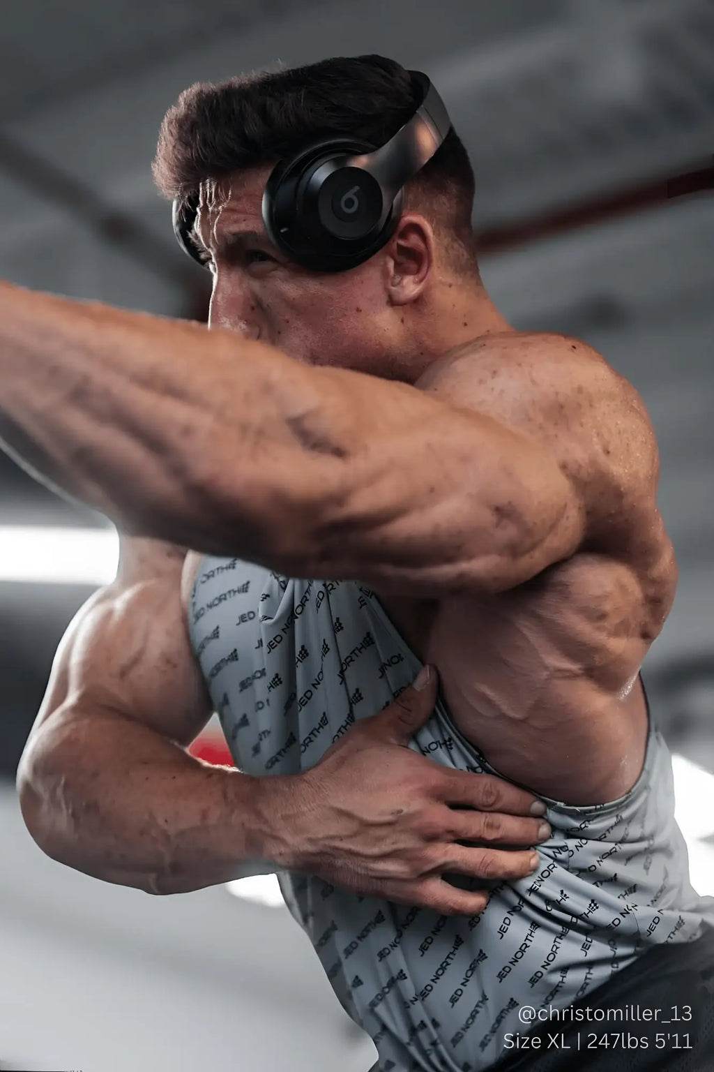 Black over-ear beats headphones with sleek matte finish shown with jed north graphic muscle stringer gray jn logo shirt