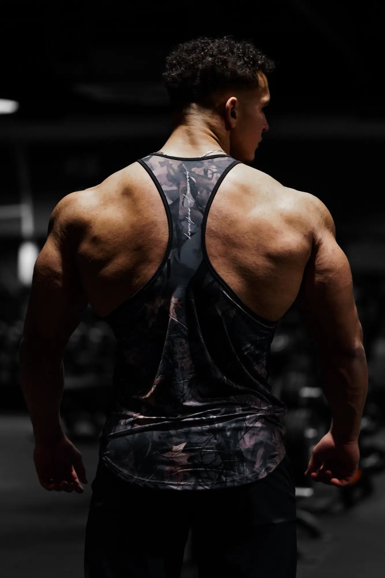 Black and gray camouflage jed north graphic muscle stringer tank top with racerback design for athletic use