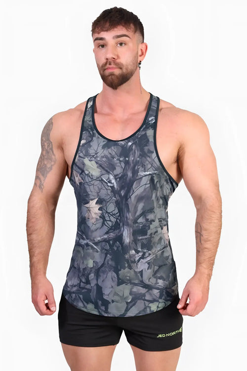 Jed North graphic muscle stringer tank top in dark gray and black hunter camo with subtle tree design