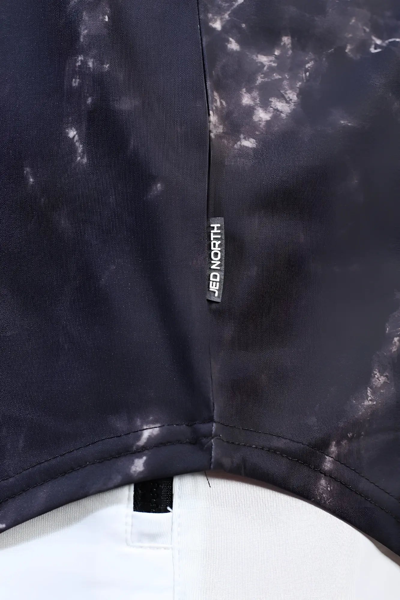 Jed North graphic muscle stringer marble in black tie-dye fabric with subtle marbled pattern and jed north tag
