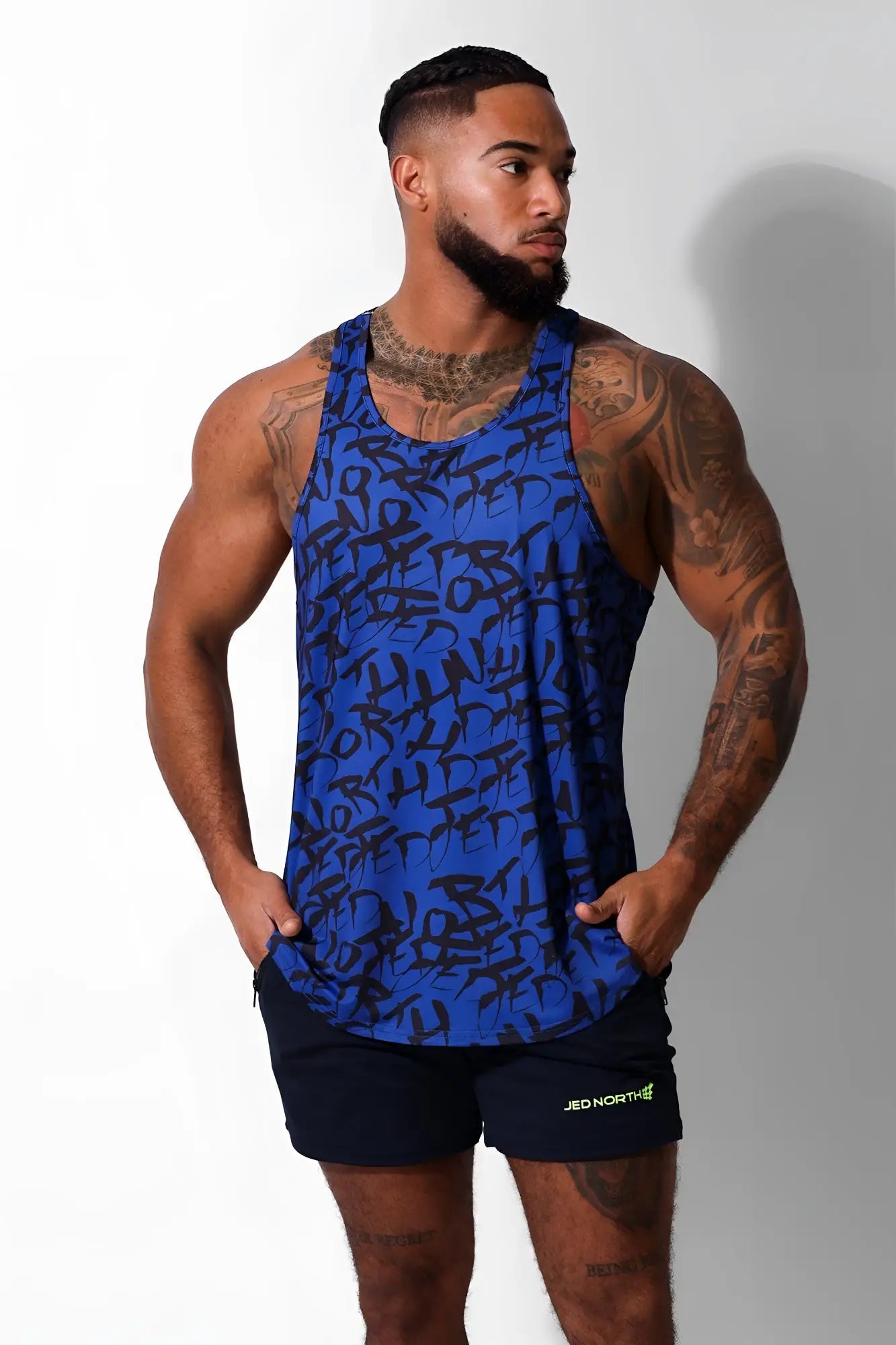 Blue Jed North graphic muscle stringer tank top with black abstract lettering pattern for athletic use