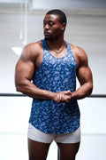 Blue paisley-patterned graphic muscle stringer tank top by jed north paired with white shorts
