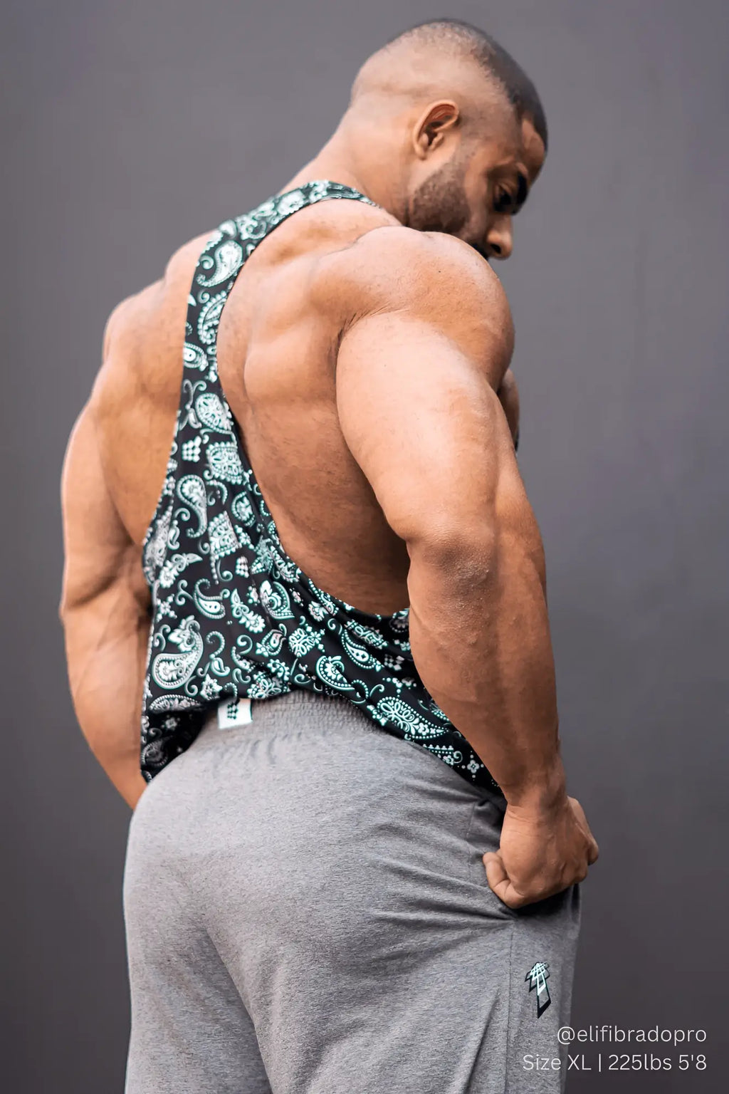 Black and teal paisley patterned graphic muscle stringer tank top with a sleeveless design for casual wear