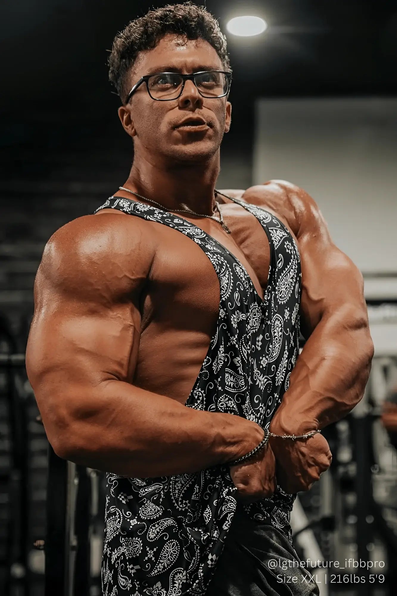 Black and white paisley-patterned graphic muscle stringer tank top for casual and athletic wear