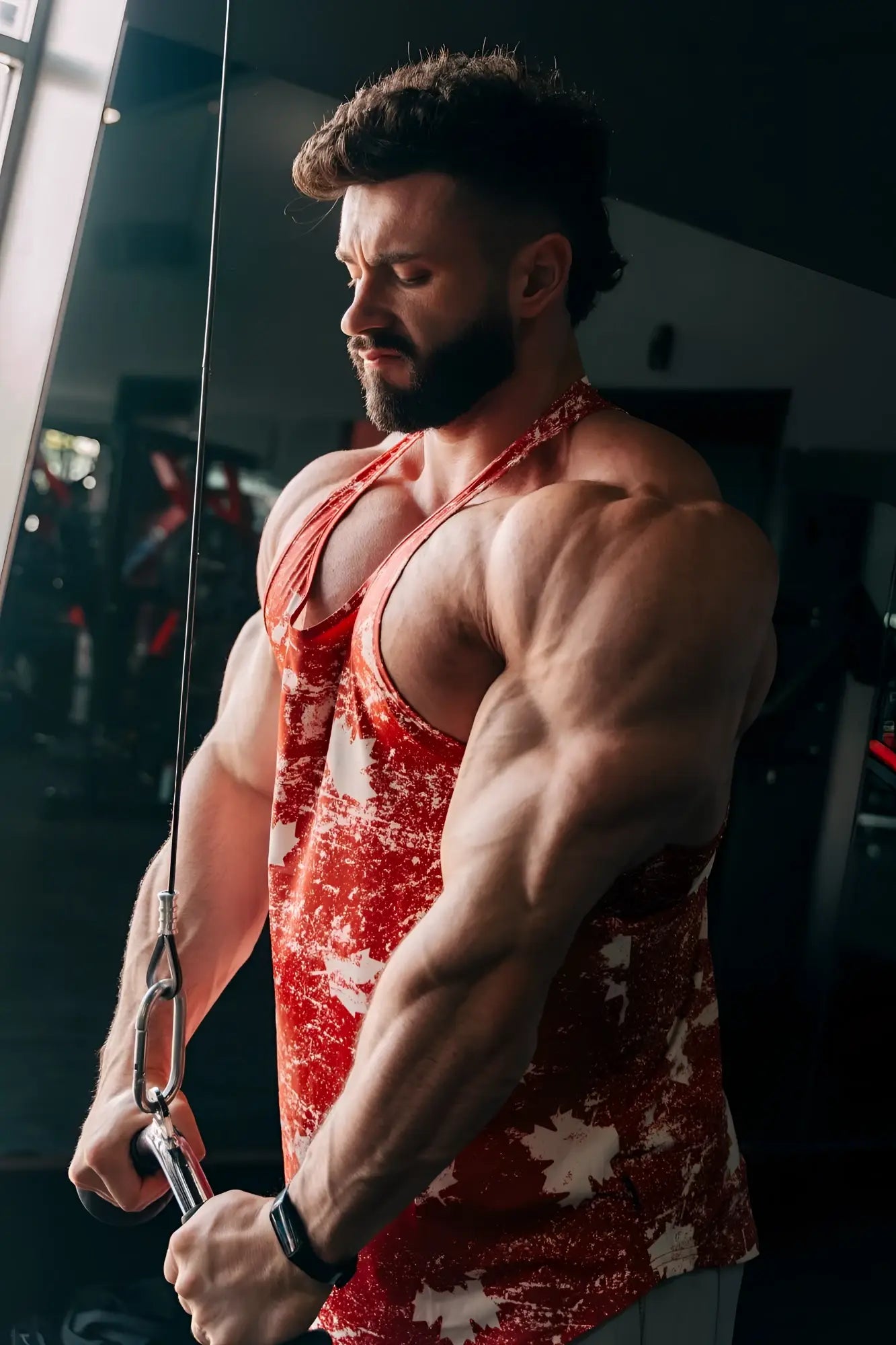 Red and white splatter patterned graphic muscle stringer athletic tank top designed for activewear and training