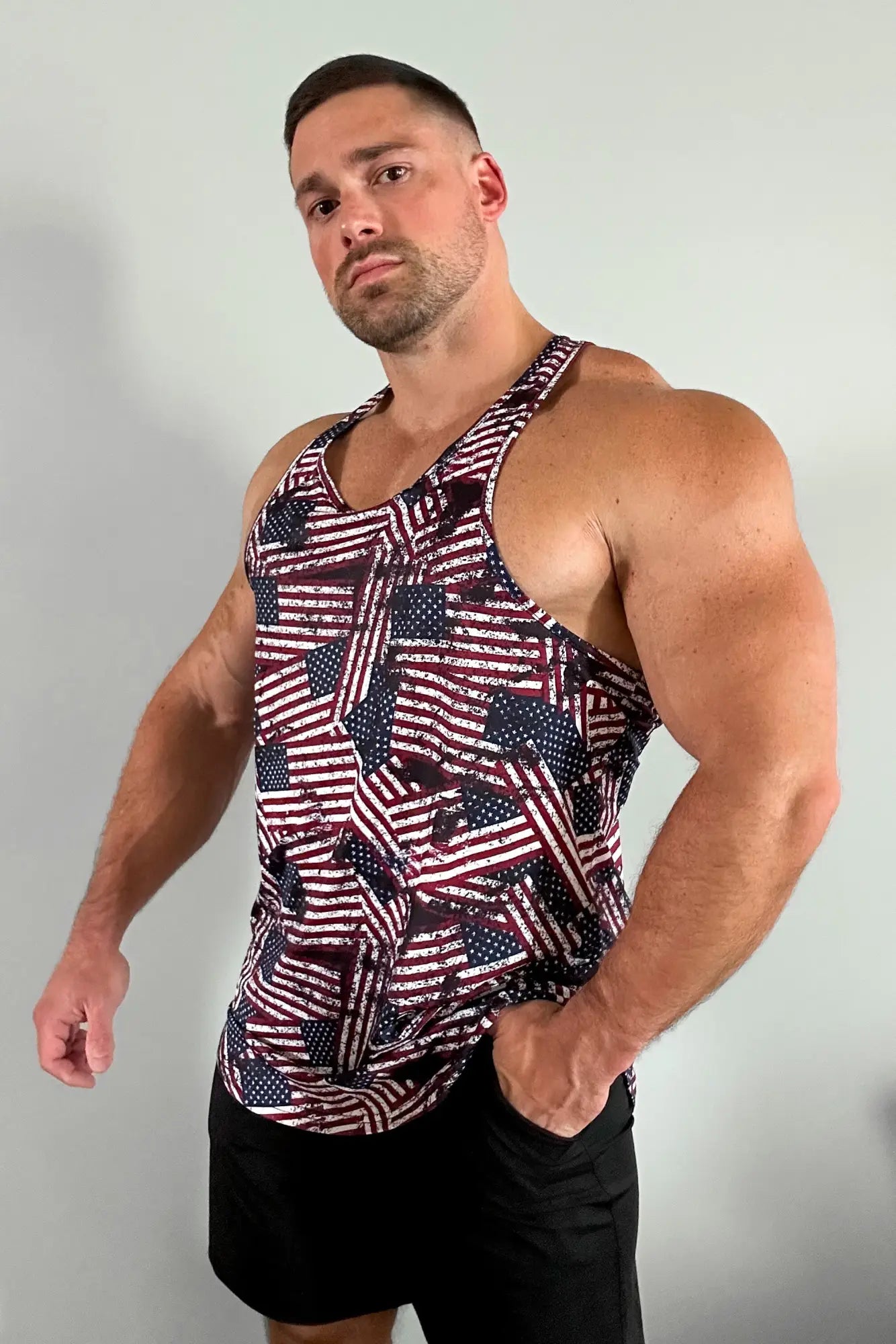 A maroon and white usa flag graphic muscle stringer tank top with a geometric patchwork design